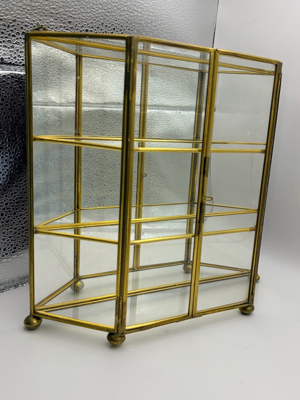 Vintage Hollywood Regency Brass & Glass 2-Door Curio Cabinet with Mirror Back.